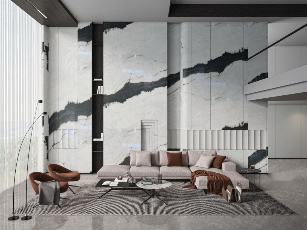 Floor-to-ceiling Panda White marble wall panels in a double-height living room